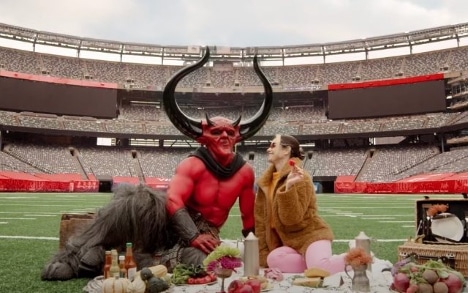 Devil and a woman having a picnic